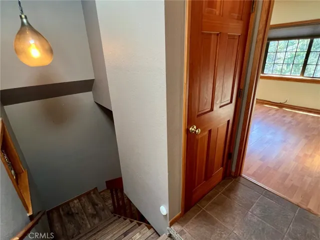 In the hallway going down to the living level of the home.