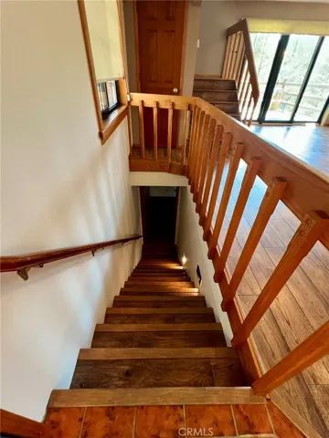 Stairs down to the primary bedroom