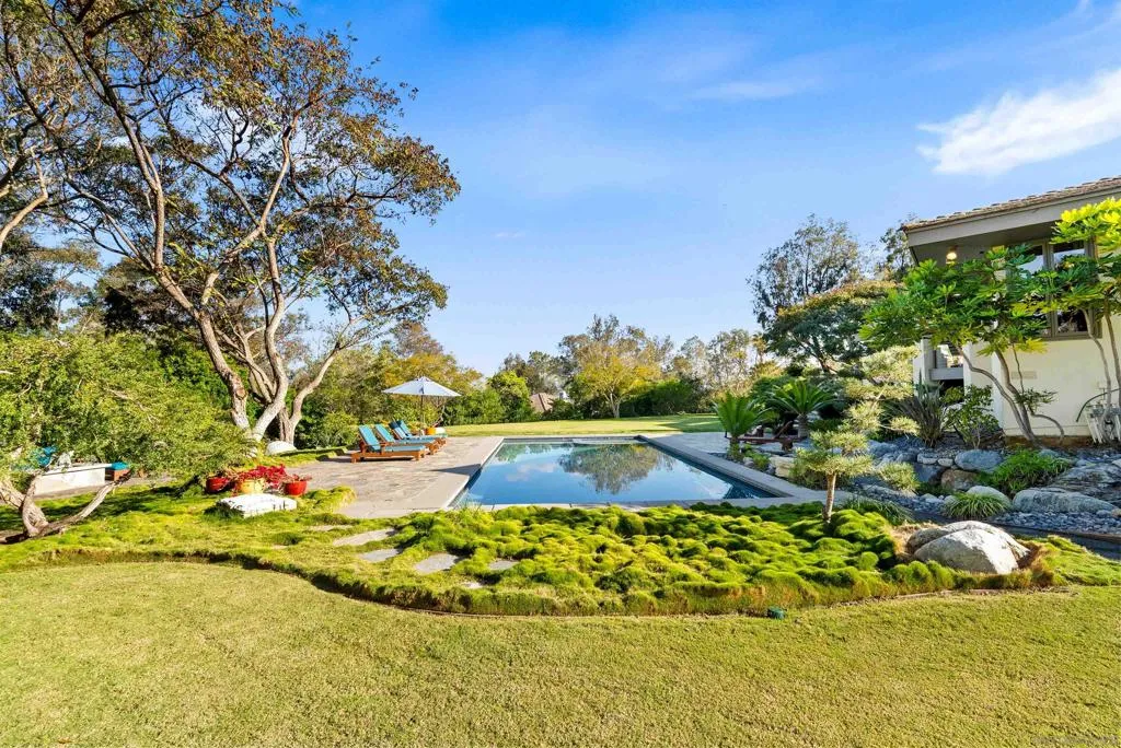 Features pool with an automatic cover, fire pit, lots of relaxing areas to soak up the sun!