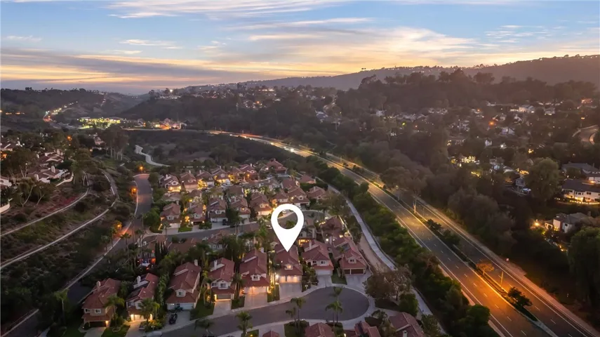 Aerial view highlighting the home's location within the surrounding community and scenic landscape.
