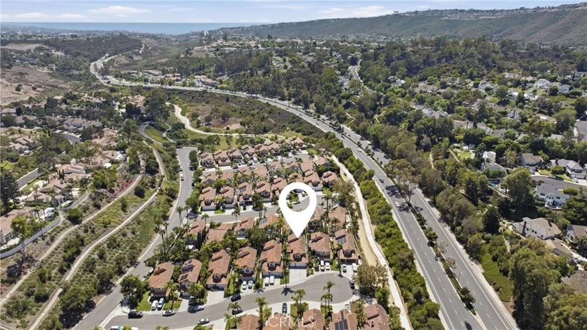 Aerial view highlighting the home's location within the surrounding community and scenic landscape.
