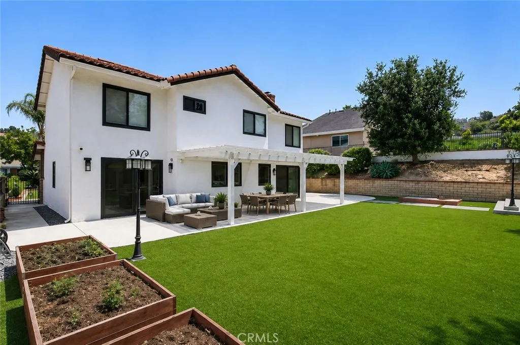 Virtually altered image of back yard and patio