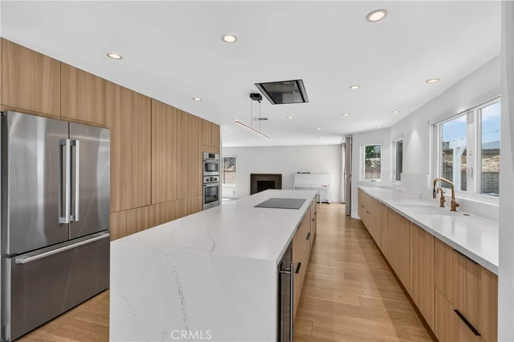 Spacious chef's kitchen with a large island and ample seating.