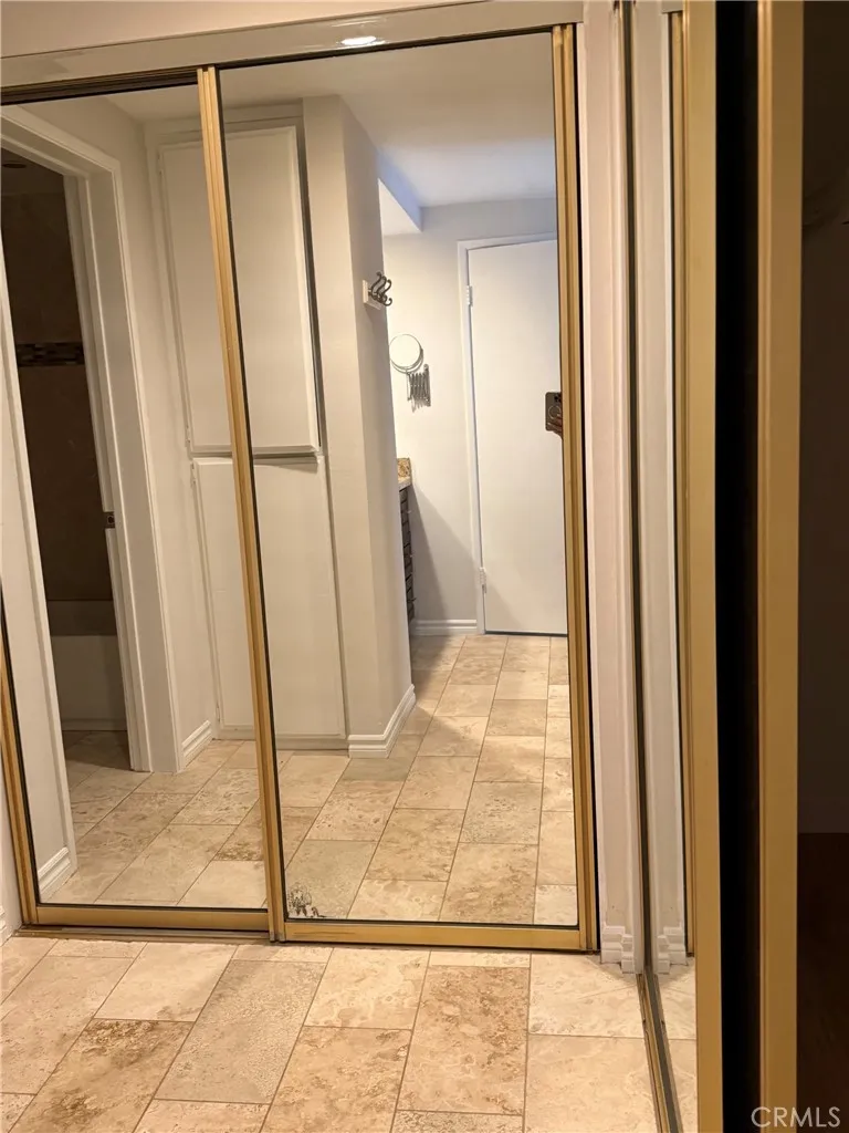 Mirror L-shape closet in primary bedroom Mirror L-shape closet in primary bedroom