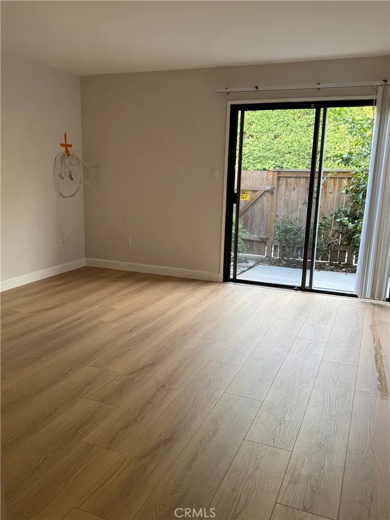 Primary bedroom with new laminated flooring throughout Primary bedroom with new laminated flooring throughout