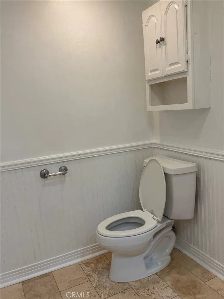 primary bathroom with wainscotting panels primary bathroom with wainscotting panels