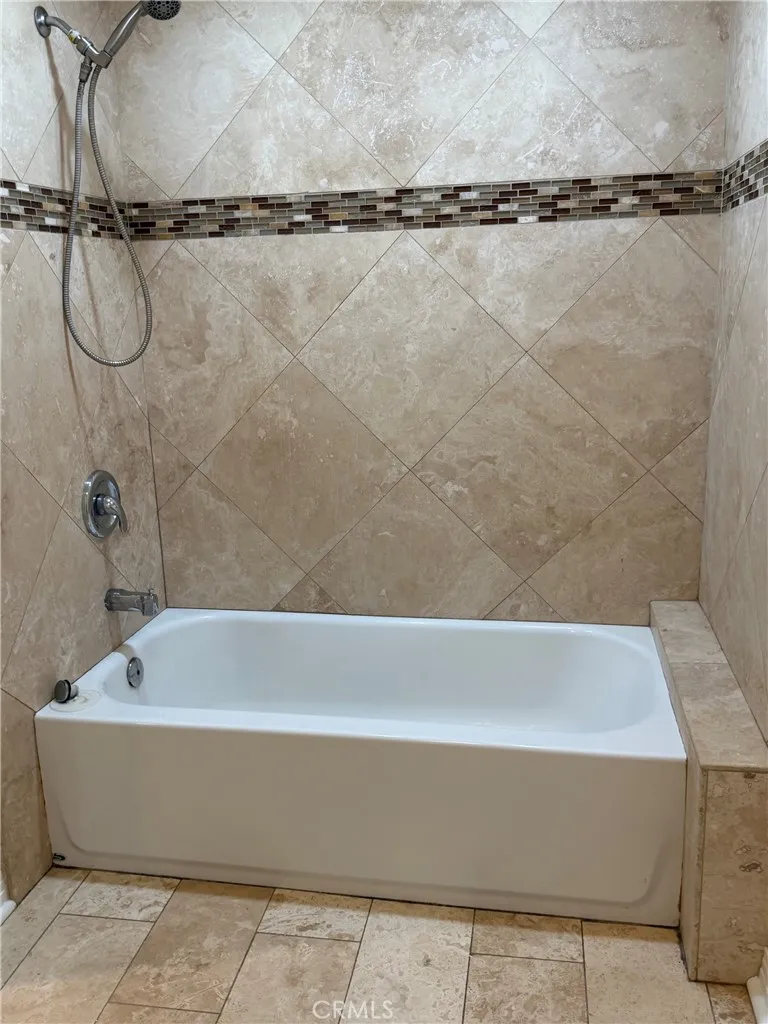 Primary full bath with travertine Primary full bath with travertine