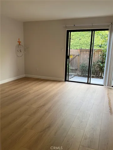 Primary bedroom with new laminated flooring throughout