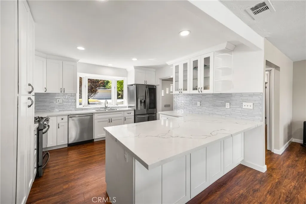 Storage on BOTH sides of the Kitchen Peninsula, Glass Front Cabinets & Display Shelves Storage on BOTH sides of the Kitchen Peninsula, Glass Front Cabinets & Display Shelves