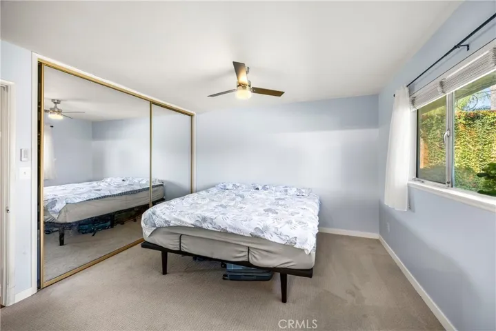 Primary Bedroom with Mirrored Closet Doors