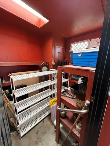 Storage room behind carport