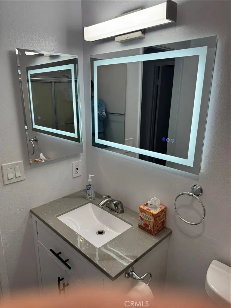 Updated bathroom with custom lighted and heated mirror and vanity Brang new toilet Updated bathroom with custom lighted and heated mirror and vanity Brang new toilet
