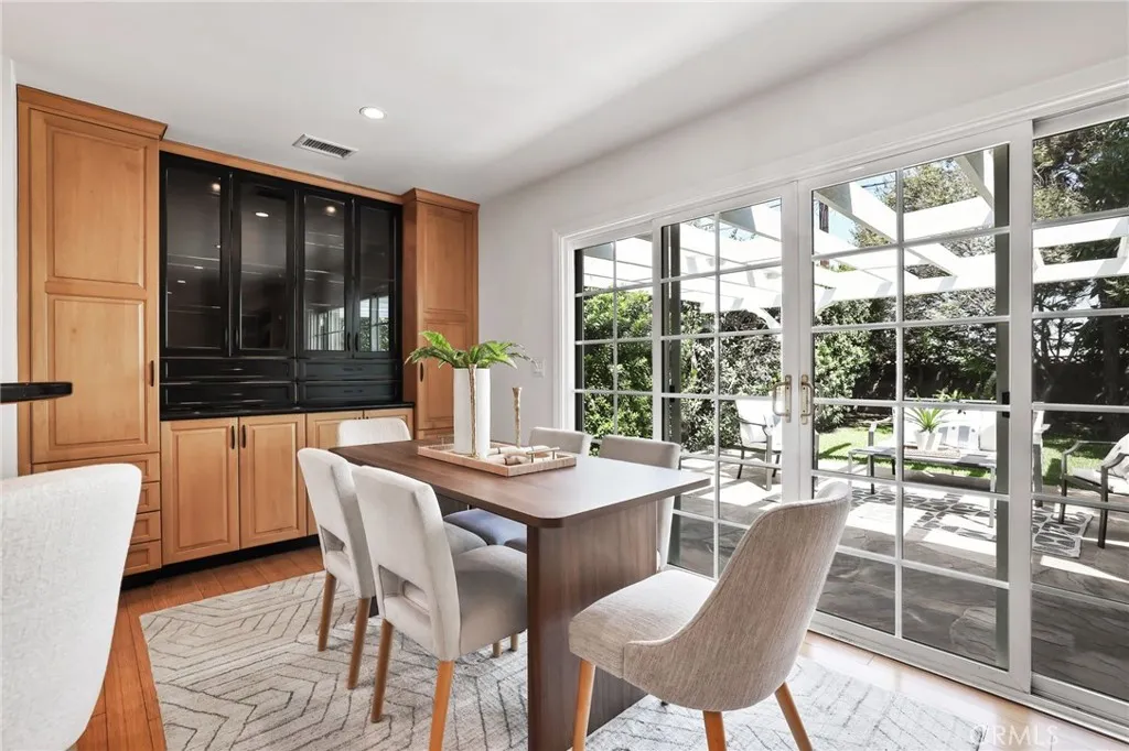 Large sliding doors to the amazing lush backyard.