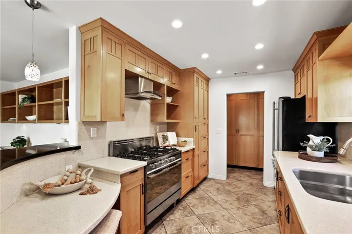 Beautiful Kitchen with Stainless Steal Appliances and 2 sided breakfast bar.