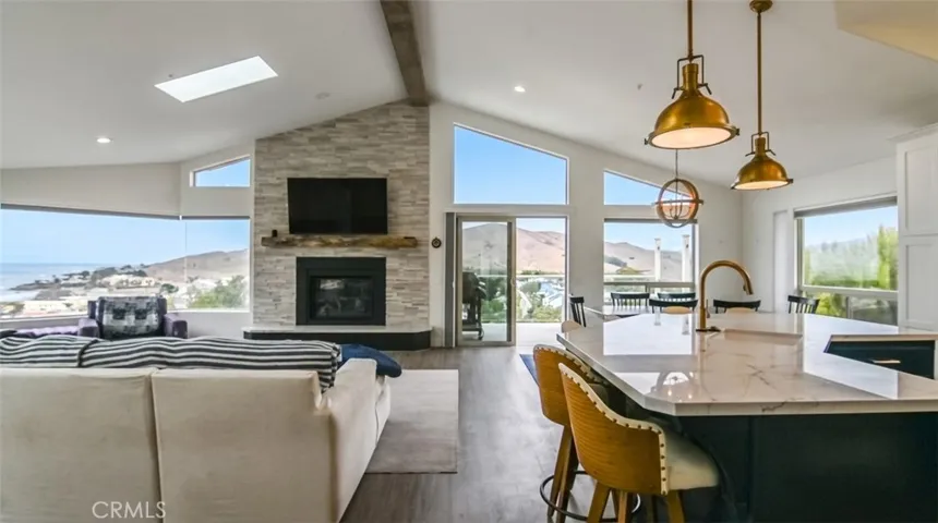 Kitchen island and living room with gas​​‌​​​​‌​​‌‌​​‌​​​‌‌​​​‌​​‌‌​​‌‌​​‌‌​​​​ fireplace
