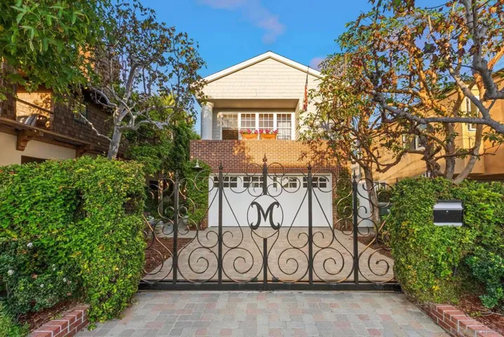 Private, gated entrance with 2-car garage and extra parking.