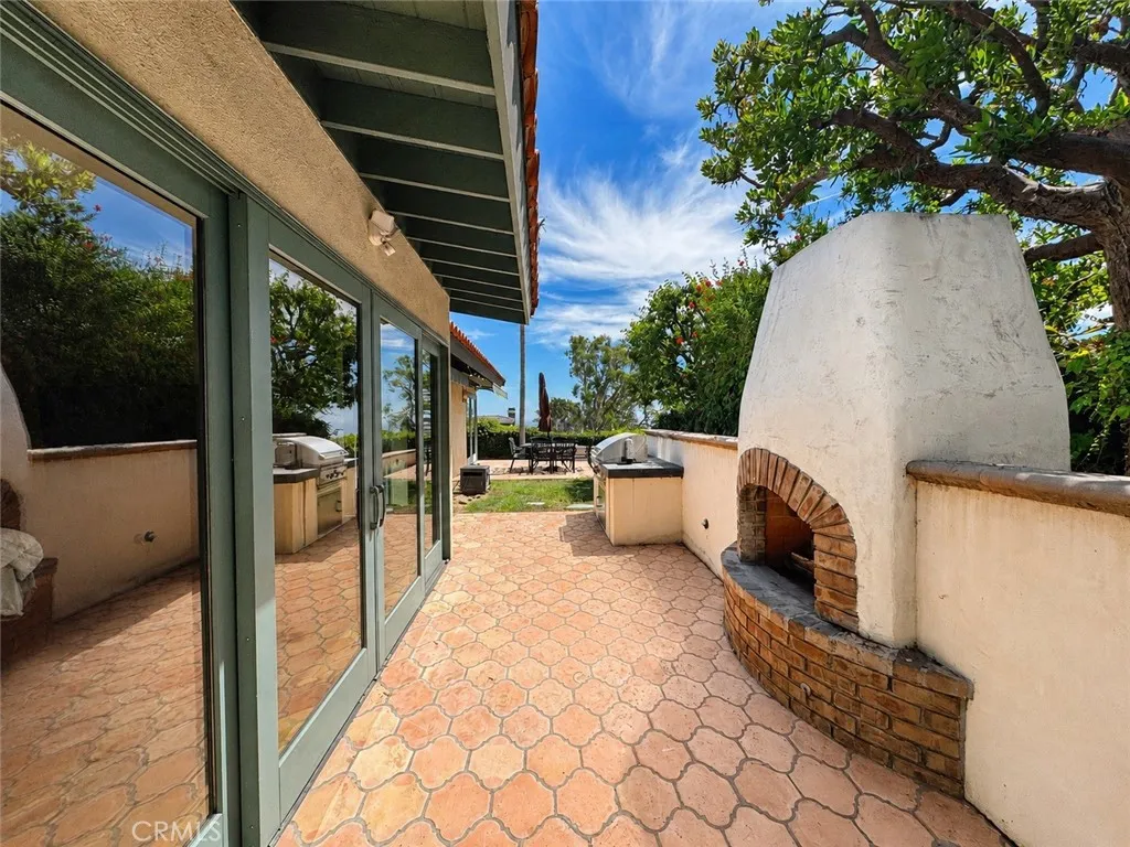 Sliding doors from the primary suite to your own outdoor fireplace