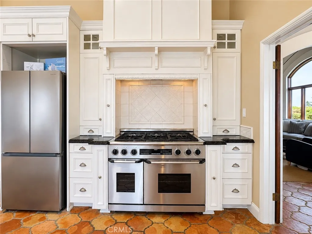 Remodeled kitchen with a six burner Dacor range