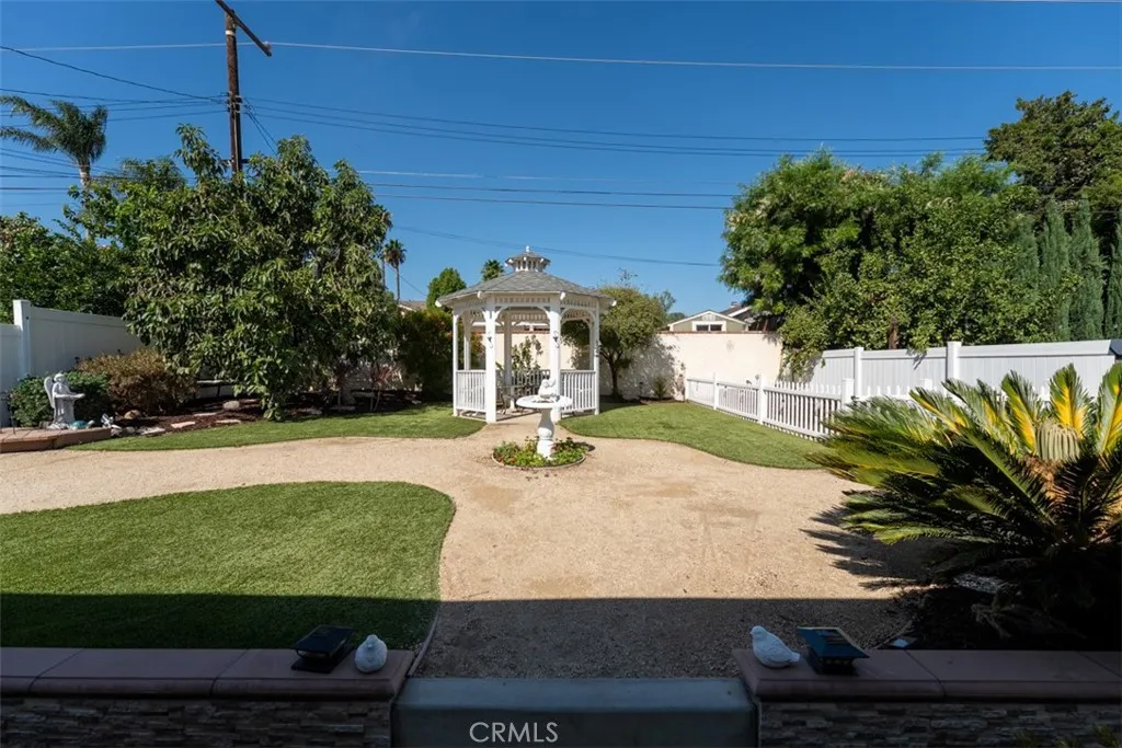 Spacious park like backyard complete with gazebo, walking paths, private garden area, and mature avocado tree! Spacious park like backyard complete with gazebo, walking paths, private garden area, and mature avocado tree!