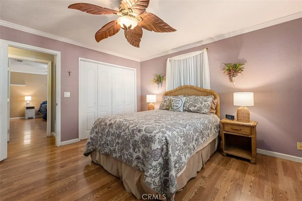 Primary bathroom feature ceiling, fan hardwood flooring, plantation shutters, and dual Pane windows Primary bathroom feature ceiling, fan hardwood flooring, plantation shutters, and dual Pane windows
