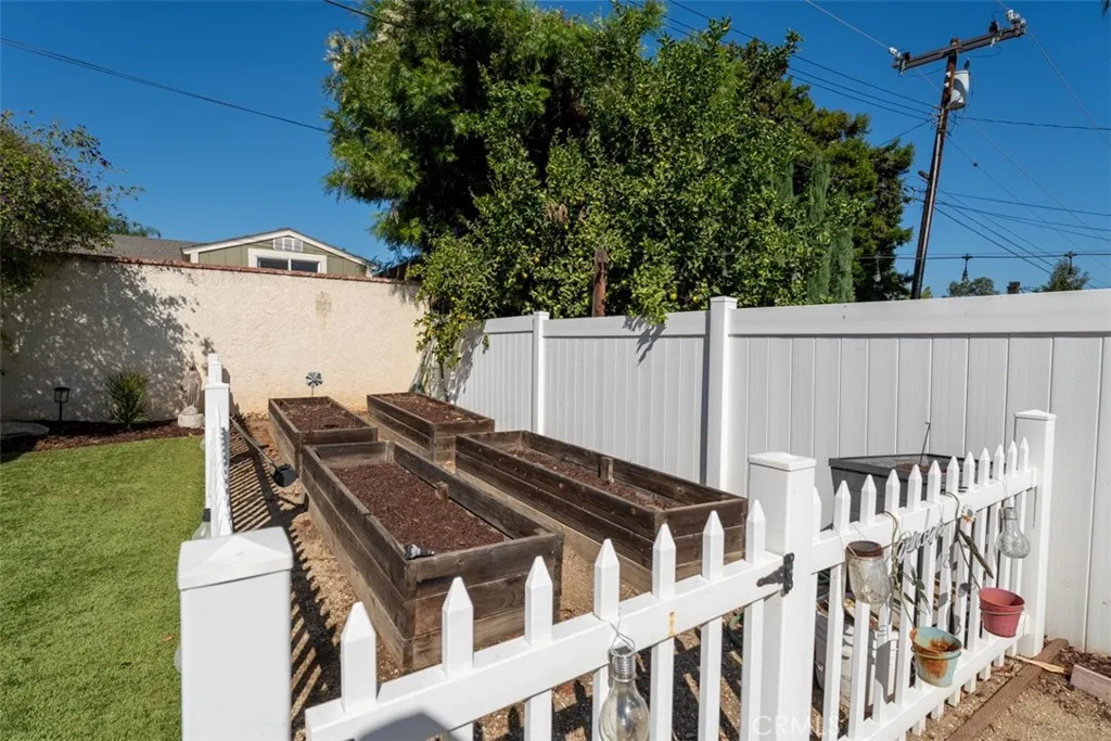 Raised garden area complete with vinyl fencing Raised garden area complete with vinyl fencing