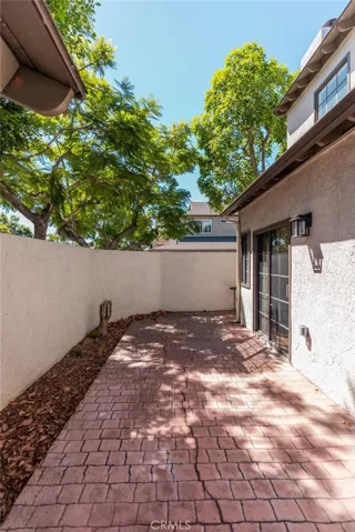 Spacious enclosed patio with brick pavers and direct access from the residence.