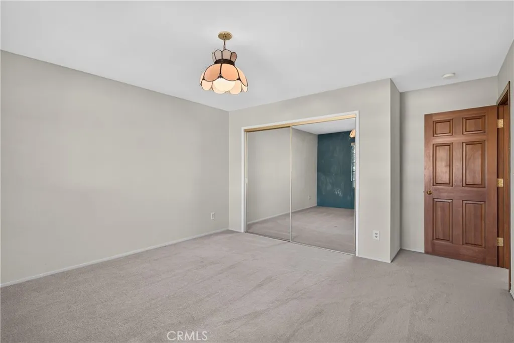 4th upstairs bedroom with mirrored closet