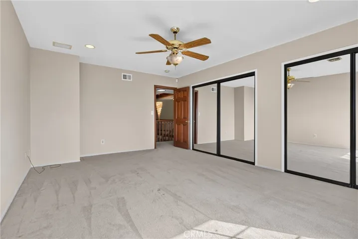 Another angle of Upstairs bedroom 2 with double mirrored closets