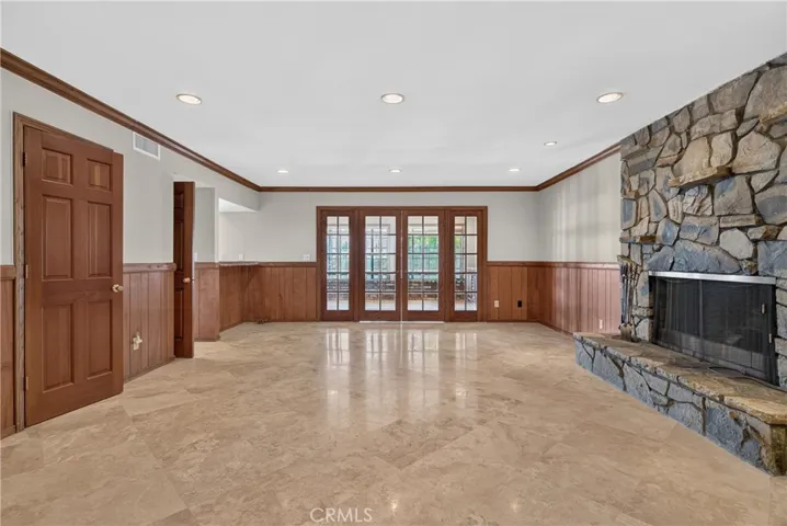 Main level family room with Fireplace/ Can be used as 5th bedroom as it has closet