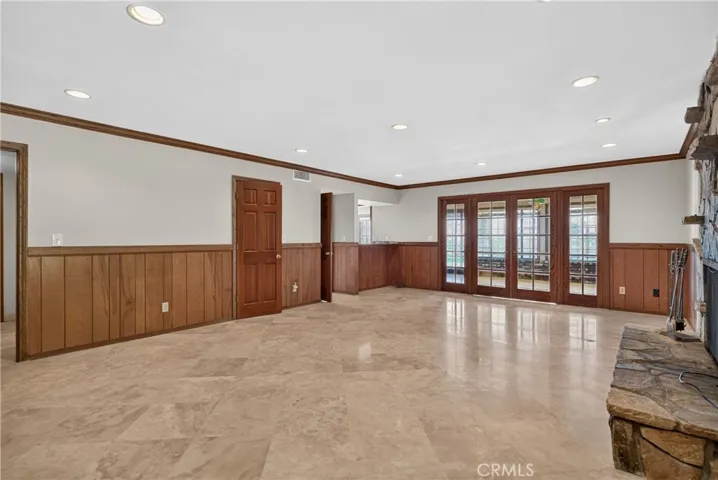 Main level family room with Fireplace/ Can be used as 5th bedroom as it has closet