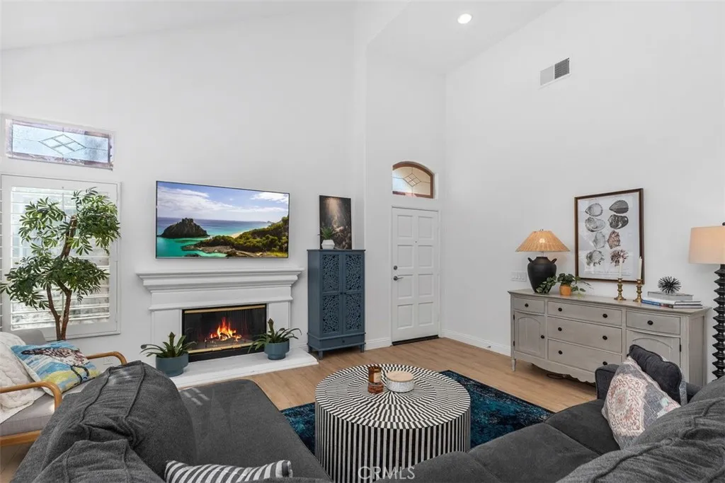 Luxurious Open Living Room. W/ Fireplace. Plantation Shutters