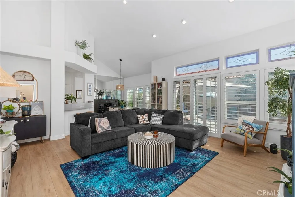 Luxurious Open Living Room. W/ Fireplace.Plantation Shutters