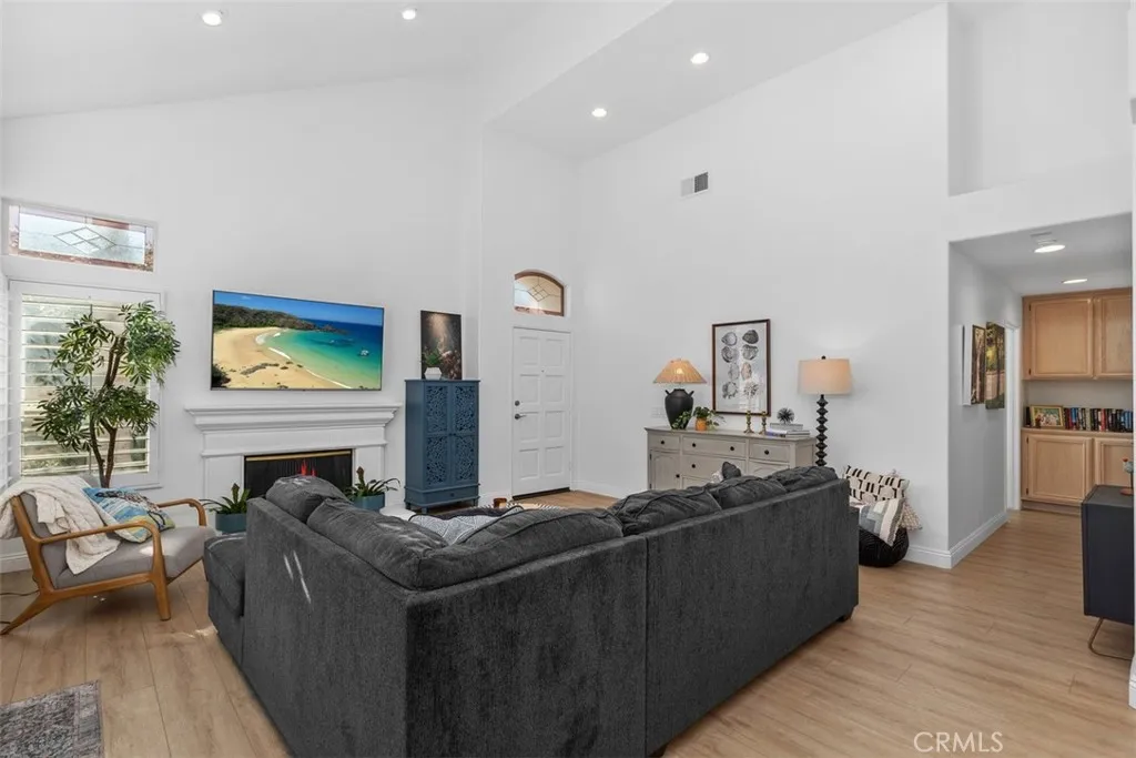 Luxurious Open Living Room. W/ Fireplace. Plantation Shutters