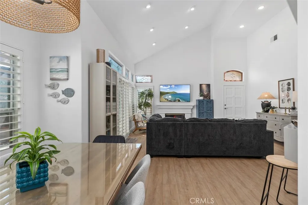 Dining room opens to the luxurious living room. Lots of light