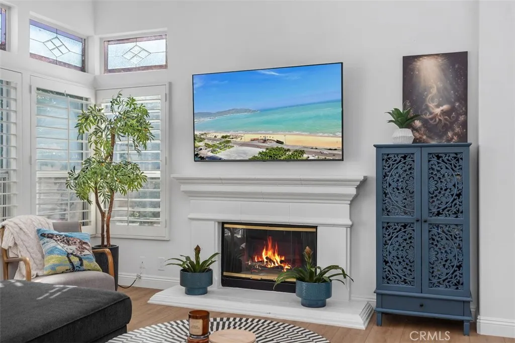 Luxurious Open Living Room. W/ Fireplace. Plantation Shutters