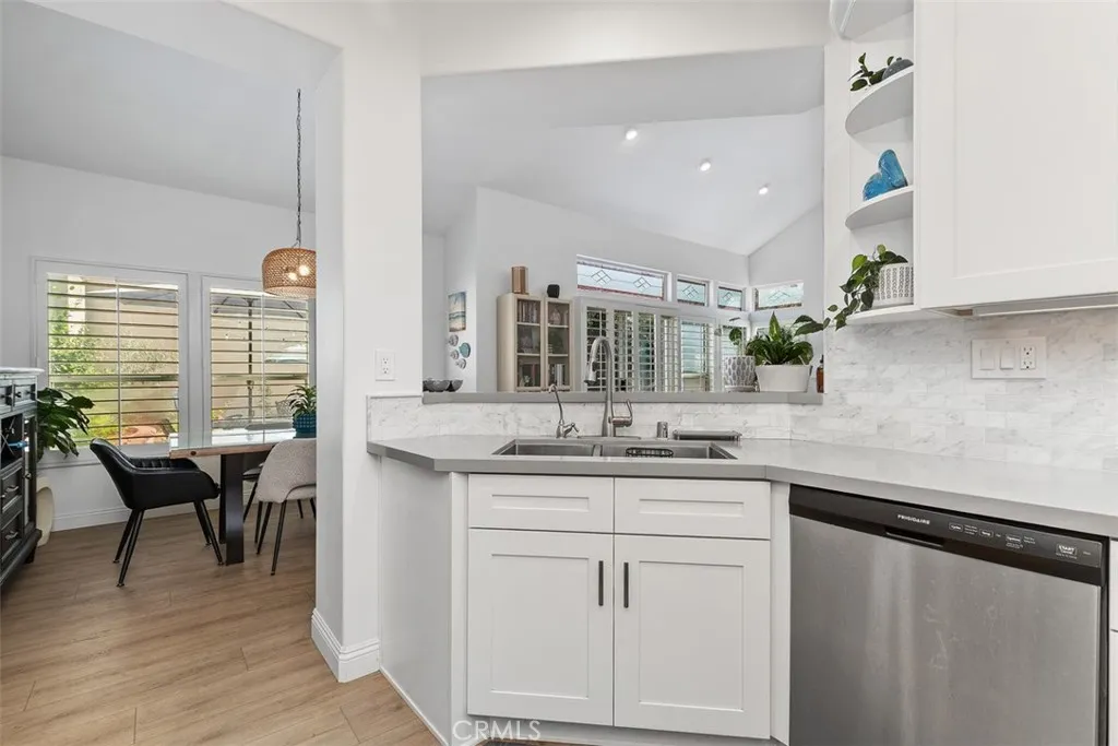 Renovated Kitchen with all new appliances. Opens to dining room.