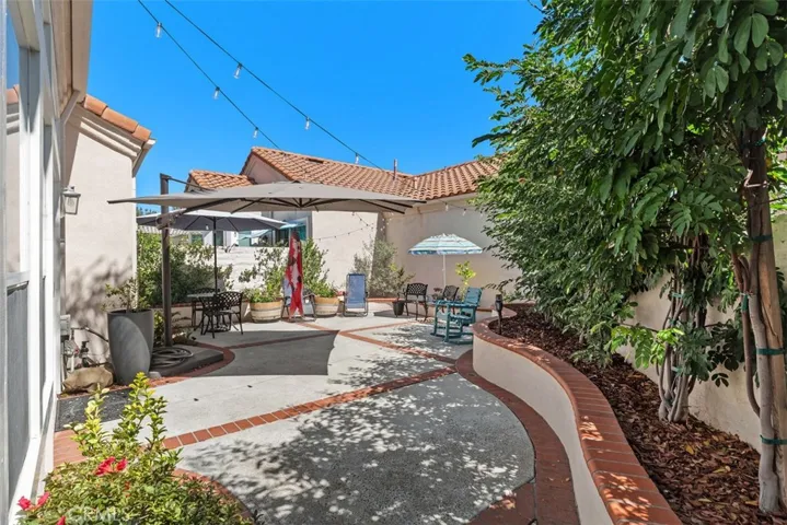 Newly renovated backyard w/newly installed privacy trees w/ new drip irrigation.