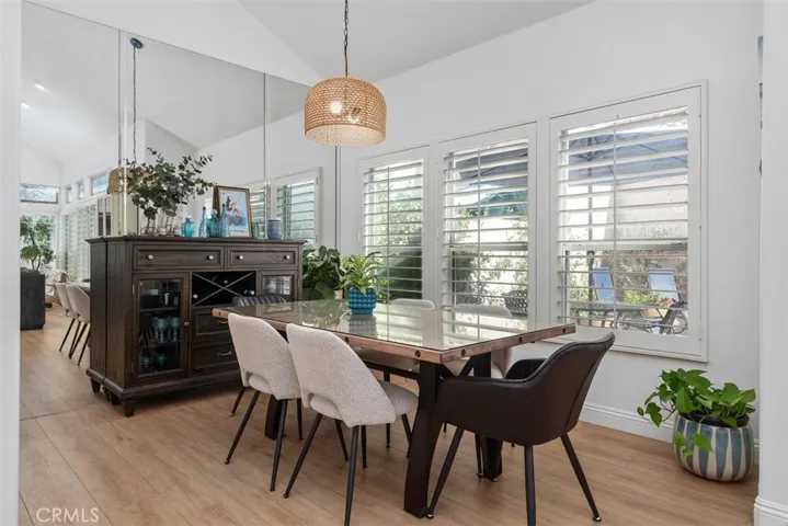 Opens up to the dining area with Plantation Shutters