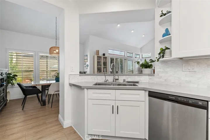 Renovated Kitchen with all new appliances. Opens to dining room.