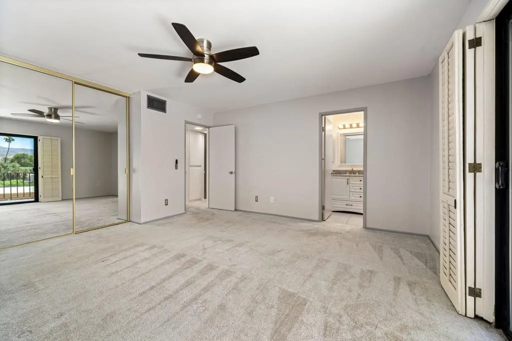 Primary bedroom with balcony