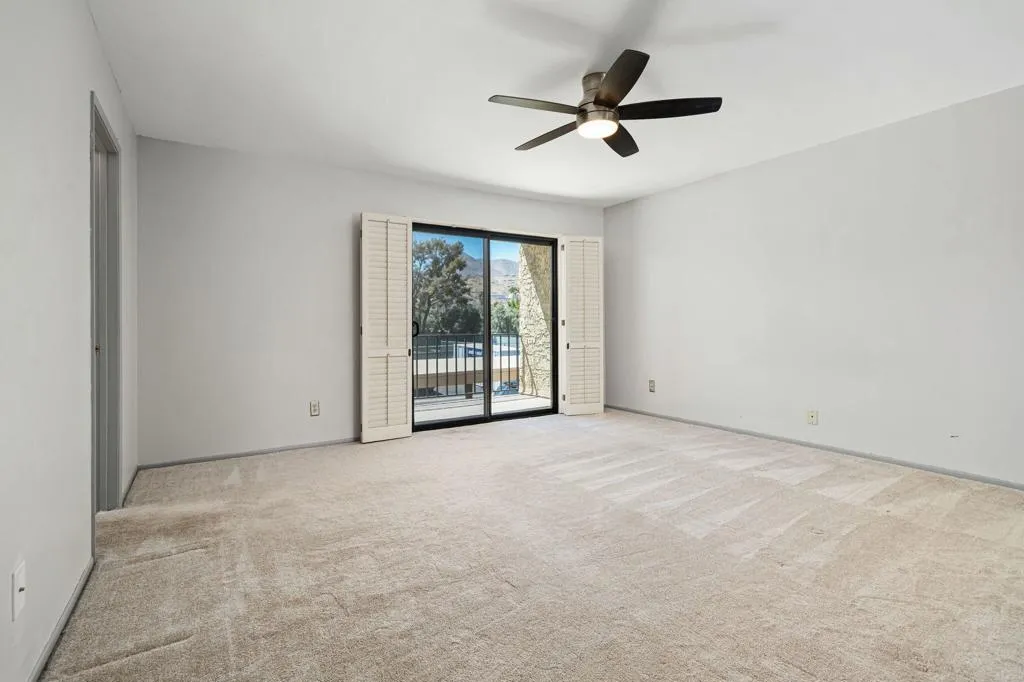 Primary bedroom with balcony