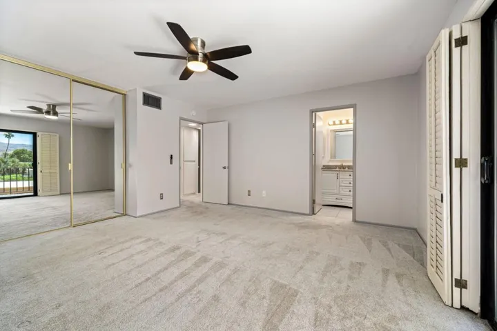 Primary bedroom with balcony