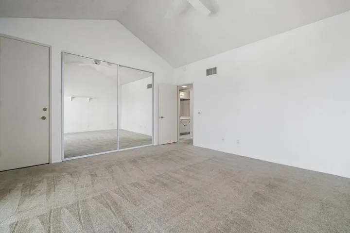 Guest bedroom with high ceiling