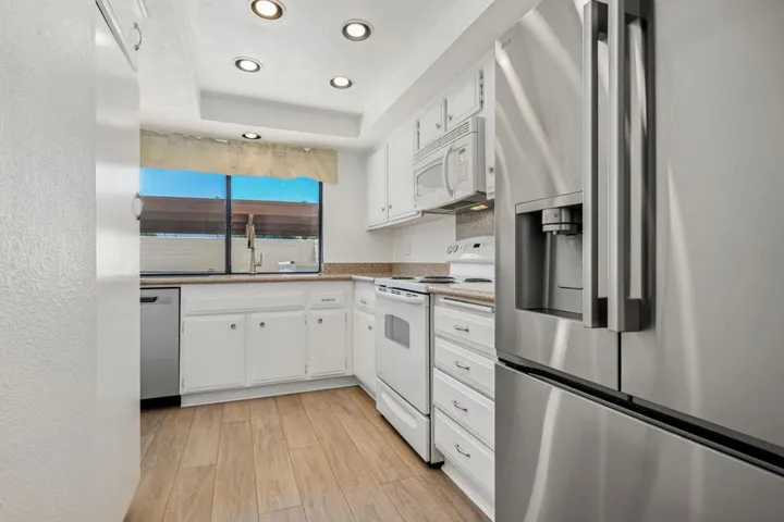 Kitchen with new fridge & dishwasher