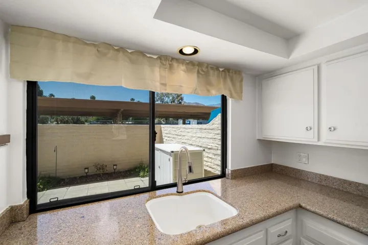 Bright kitchen overlooking backpatio