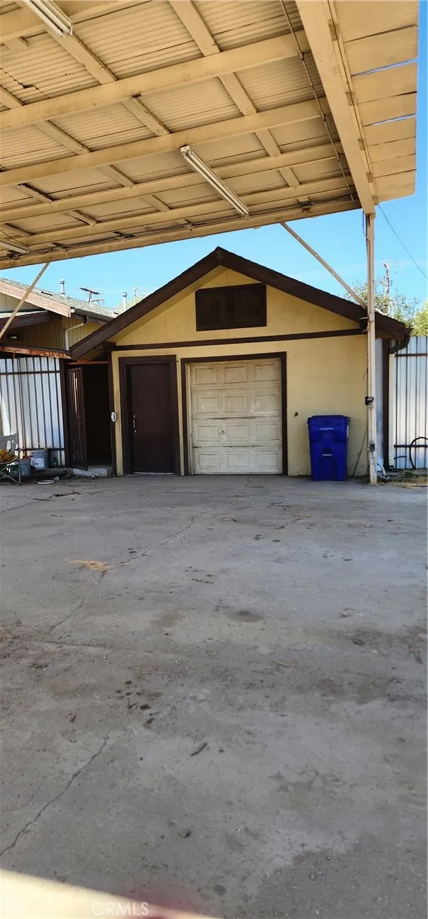 deep workshop with remote rollup door, 220v. the door leads to a private restroom convenient while working.