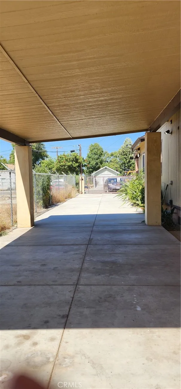 unit #2 address 3130 view of the carport and driveway with private access gate from back to front
