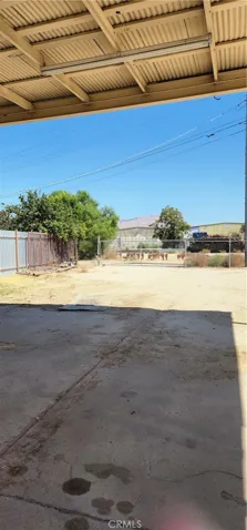 View to the back of the private storage lot with large vehicle carport