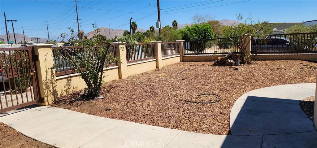 unit #1 address 3112 front yard with private yard and secure entry gate to the front