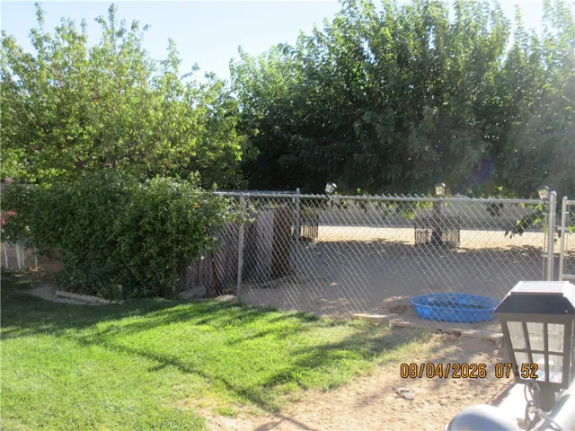 Rear Yard,crossed fenced  for trees & Pups